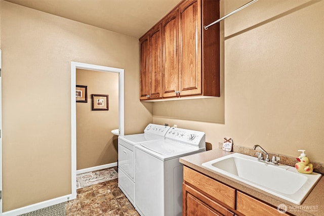108 Reynolds Rd, Castle Rock, WA 98611 - laundry area featuring separate washer and dryer, cabinet space, baseboards, and dark stone finish floors