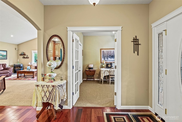 108 Reynolds Rd, Castle Rock, WA 98611 - foyer entrance featuring dark wood-style floors, french doors, arched walkways, and baseboards