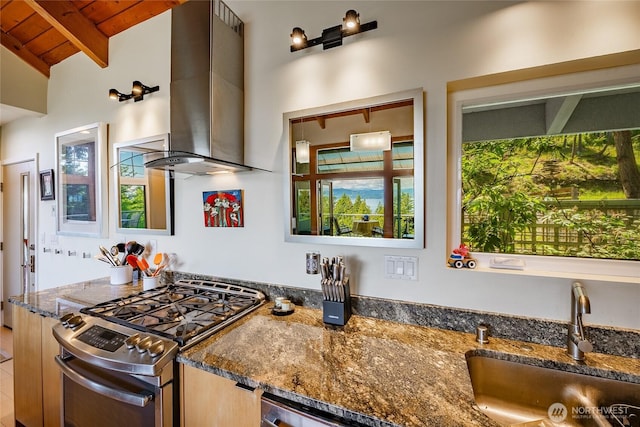 1116 Island Dr, Lummi Island, WA 98262 - kitchen with gas range, wall chimney range hood, a sink, wooden ceiling, and dark stone counters