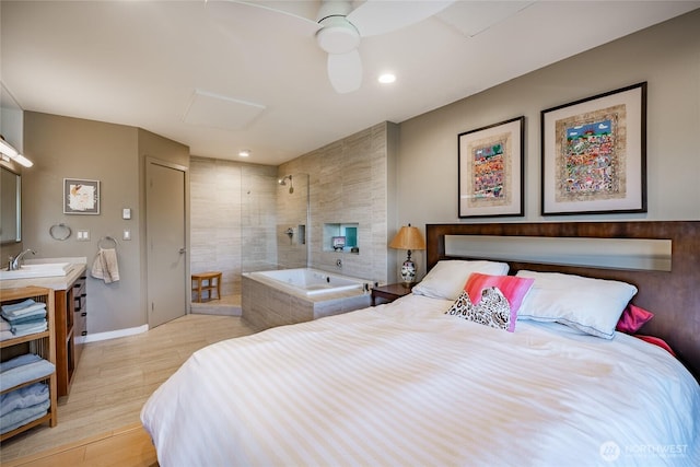 1116 Island Dr, Lummi Island, WA 98262 - bedroom featuring light wood-style floors, baseboards, a ceiling fan, and a sink