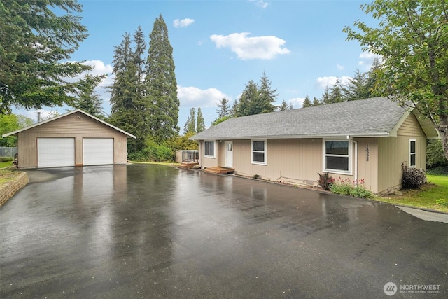 18222 4th Ave S, Burien, WA 98148 - view of front of home featuring a garage, an outdoor structure, and a shingled roof