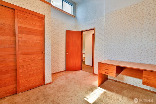 257 Point Brown Ave SW, Ocean Shores, WA 98569 - unfurnished office featuring carpet flooring and wallpapered walls