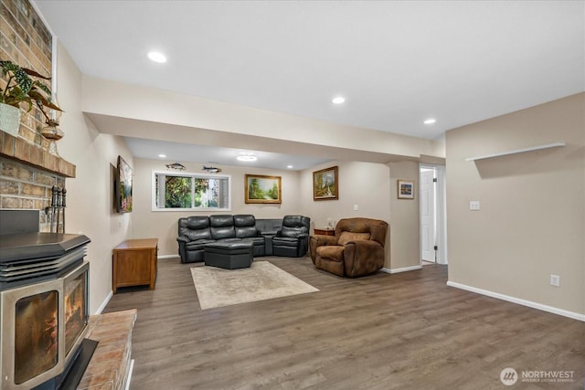 17631 69th Pl W, Edmonds, WA 98026 - living area featuring a wood stove, wood finished floors, baseboards, and recessed lighting