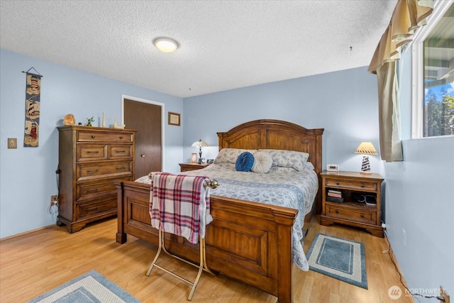 17631 69th Pl W, Edmonds, WA 98026 - bedroom featuring a textured ceiling and light wood finished floors