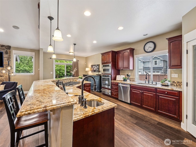 20714 61st St E, Bonney Lake, WA 98391 - kitchen with a sink, appliances with stainless steel finishes, a warming drawer, light stone countertops, and recessed lighting