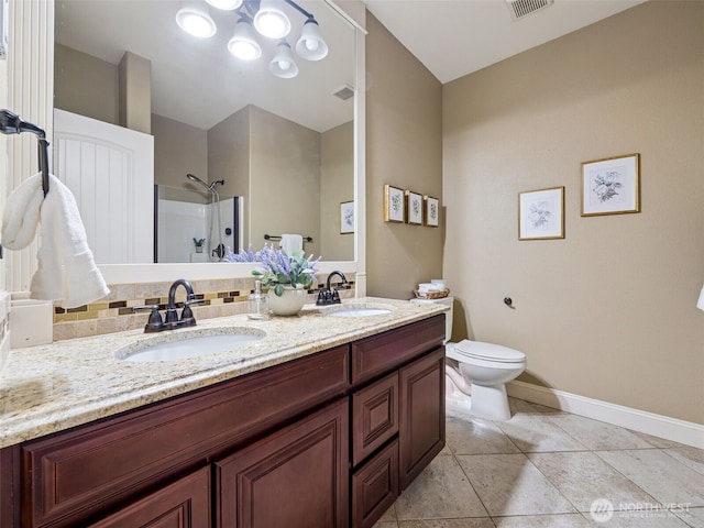 20714 61st St E, Bonney Lake, WA 98391 - bathroom featuring double vanity, a shower, toilet, baseboards, and tile patterned floors