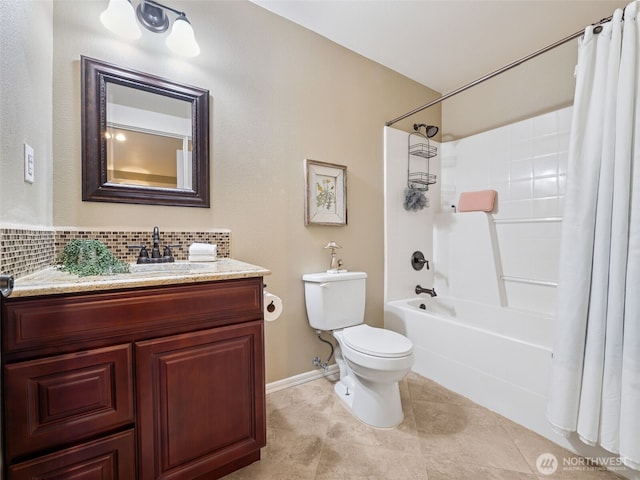 20714 61st St E, Bonney Lake, WA 98391 - full bathroom featuring toilet, shower / tub combo, vanity, decorative backsplash, and baseboards