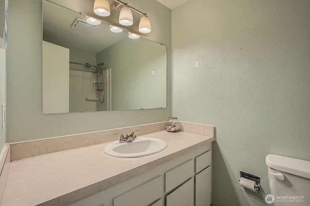 8918 108th St SW, Lakewood, WA 98498 - full bathroom featuring vanity, toilet, and a shower