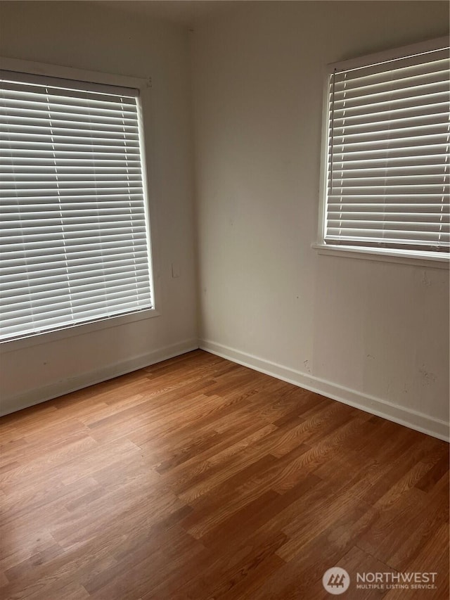 28 N Fir St, Omak, WA 98841 - spare room with wood finished floors and baseboards