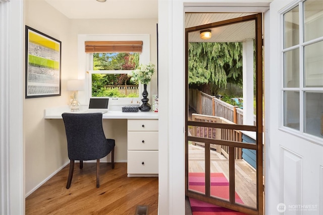 4529 Eastern Ave N, Seattle, WA 98103 - office space with built in study area and light wood-style floors