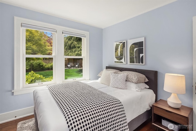 4529 Eastern Ave N, Seattle, WA 98103 - bedroom featuring dark wood finished floors, baseboards, and crown molding