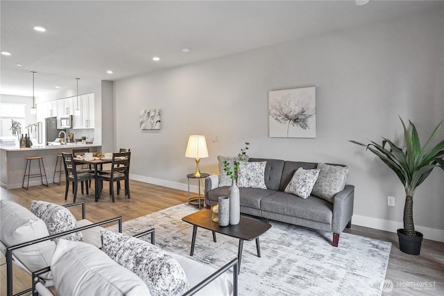 825 238th Pl SE Unit D, Bothell, WA 98021 - living area with recessed lighting, baseboards, and light wood-type flooring