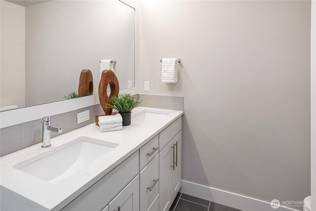 825 238th Pl SE Unit D, Bothell, WA 98021 - bathroom featuring tasteful backsplash, double vanity, tile patterned flooring, and baseboards