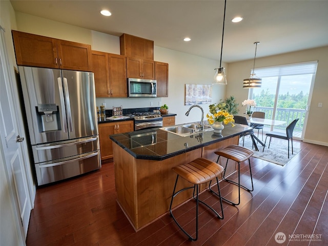 6941 134th Ct SE Unit B, Newcastle, WA 98059 - kitchen featuring appliances with stainless steel finishes, a sink, brown cabinets, dark wood-style floors, and recessed lighting