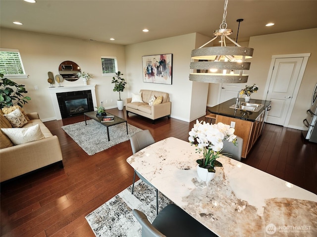 6941 134th Ct SE Unit B, Newcastle, WA 98059 - living area featuring dark wood-type flooring, recessed lighting, a fireplace, and baseboards
