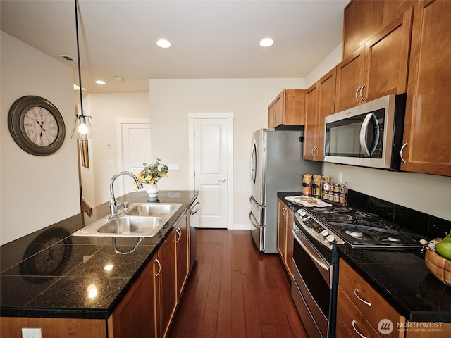 6941 134th Ct SE Unit B, Newcastle, WA 98059 - kitchen with stainless steel appliances, a sink, dark wood-style floors, brown cabinetry, and dark countertops