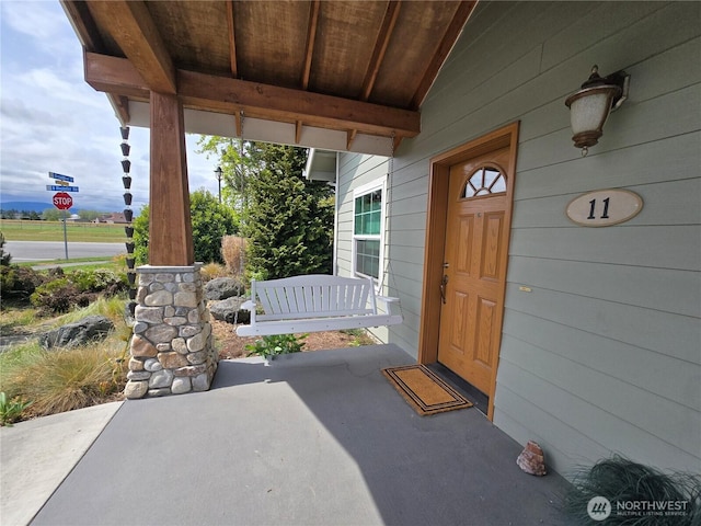 property entrance with a porch