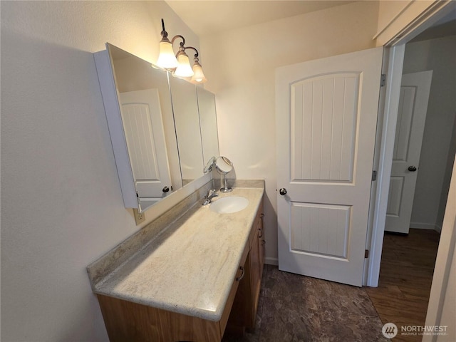 bathroom featuring wood finished floors and vanity