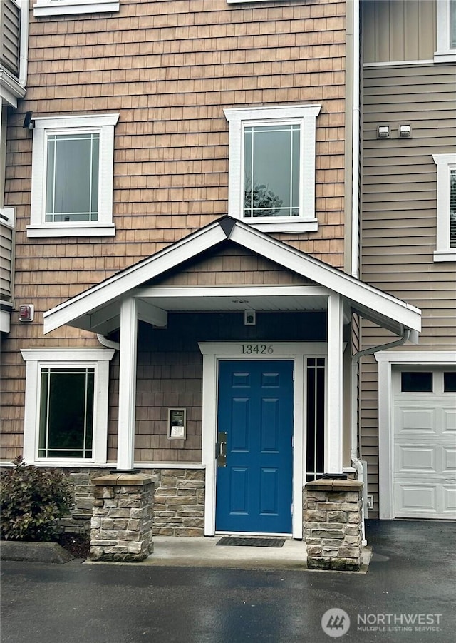 13426 97th Ave E Unit 301, Puyallup, WA 98373 - view of exterior entry featuring stone siding