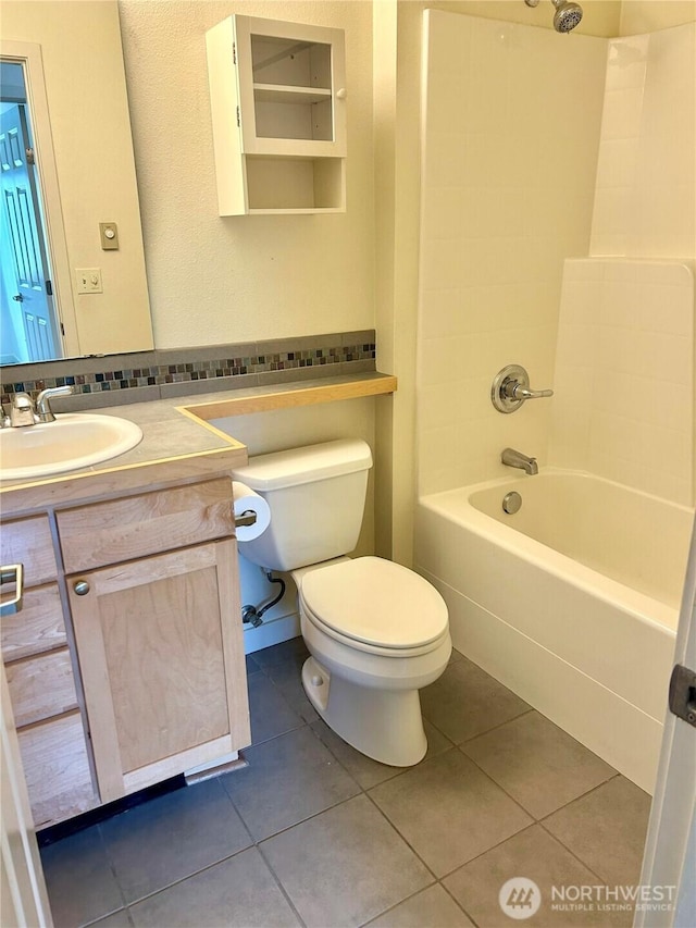 13426 97th Ave E Unit 301, Puyallup, WA 98373 - full bath featuring tile patterned floors, toilet, shower / washtub combination, and vanity