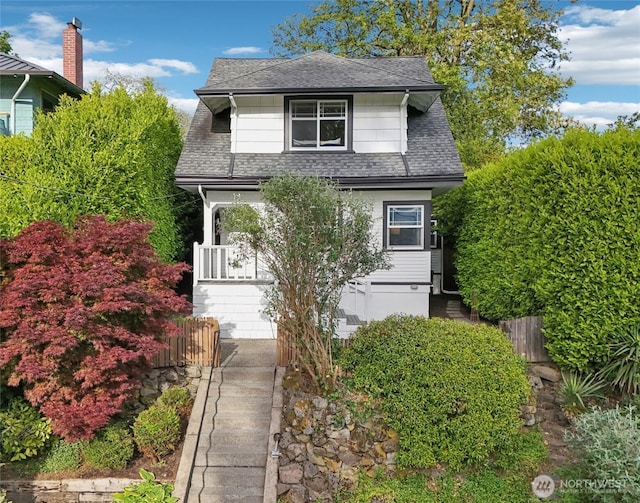 928 31st Ave, Seattle, WA 98122 - view of front facade featuring a shingled roof and stairway