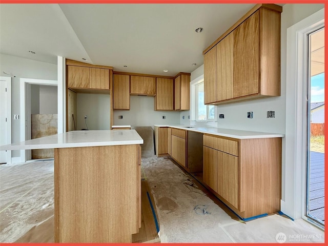 455 N Portal Loop SW, Ocean Shores, WA 98569 - kitchen with a center island and brown cabinetry