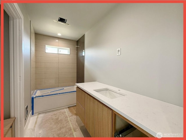 455 N Portal Loop SW, Ocean Shores, WA 98569 - bathroom featuring vanity and bathtub / shower combination