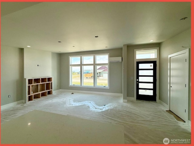 455 N Portal Loop SW, Ocean Shores, WA 98569 - foyer entrance featuring a wall mounted air conditioner, healthy amount of natural light, baseboards, and recessed lighting