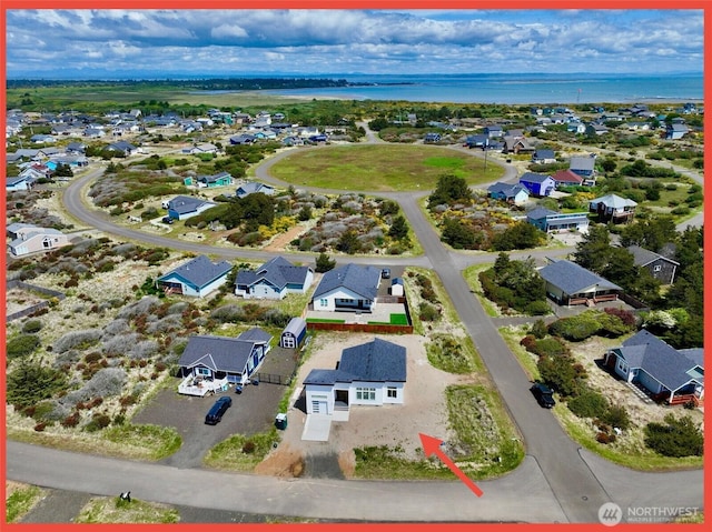 455 N Portal Loop SW, Ocean Shores, WA 98569 - aerial view of residential area featuring a nearby body of water