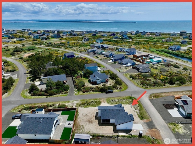 455 N Portal Loop SW, Ocean Shores, WA 98569 - aerial view of residential area with a nearby body of water