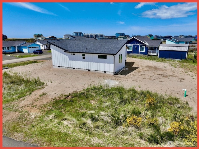 455 N Portal Loop SW, Ocean Shores, WA 98569 - view of side of home featuring crawl space, roof with shingles, and a residential view