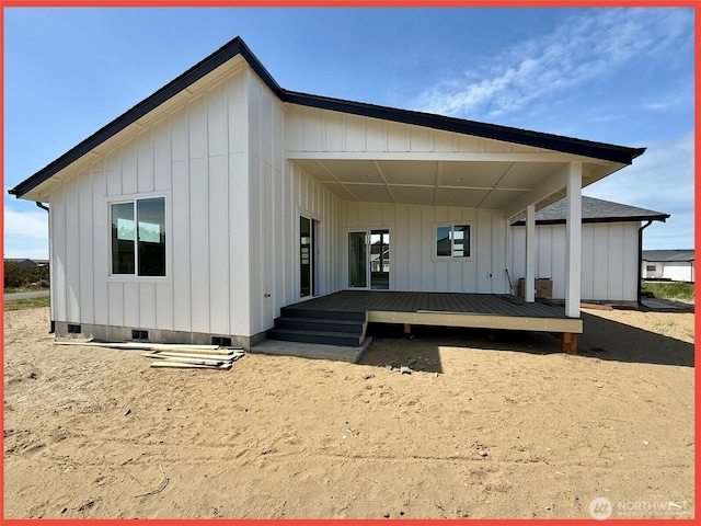 455 N Portal Loop SW, Ocean Shores, WA 98569 - rear view of house featuring a deck, crawl space, and board and batten siding