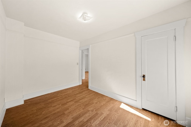 21500 US-97, Orondo, WA 98843 - unfurnished bedroom featuring wood finished floors and baseboards