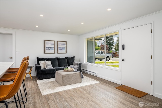 5705 241st St SW, Mountlake Terrace, WA 98043 - living room featuring a baseboard heating unit, wood finished floors, recessed lighting, ornamental molding, and baseboards