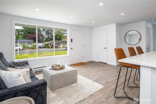 5705 241st St SW, Mountlake Terrace, WA 98043 - living area with light wood-style floors, a baseboard radiator, recessed lighting, baseboards, and ornamental molding