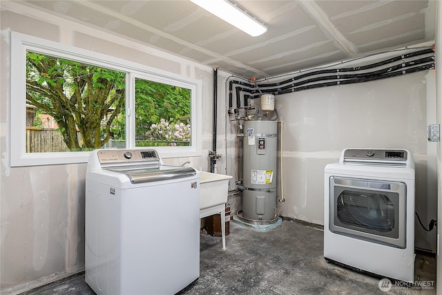 5705 241st St SW, Mountlake Terrace, WA 98043 - laundry area with strapped water heater and washing machine and dryer