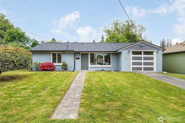 5705 241st St SW, Mountlake Terrace, WA 98043 - view of front facade with a front lawn, driveway, roof with shingles, an attached garage, and stucco siding
