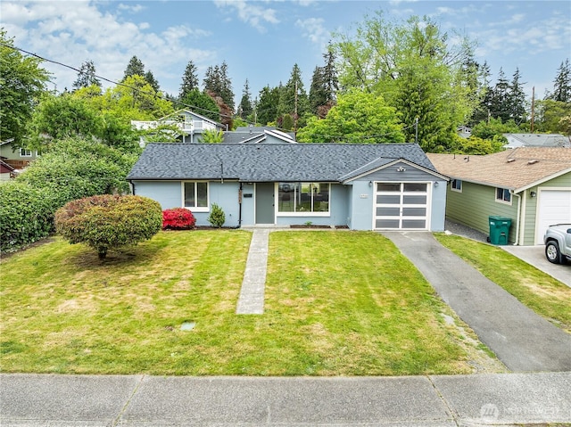 5705 241st St SW, Mountlake Terrace, WA 98043 - view of front facade featuring driveway, a garage, a shingled roof, a front yard, and stucco siding