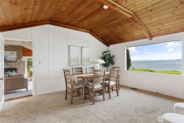 3115 Saratoga Rd, Langley, WA 98260 - dining area with lofted ceiling, wood ceiling, plenty of natural light, a water view, and wooden walls