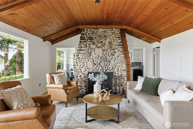 3115 Saratoga Rd, Langley, WA 98260 - living area with vaulted ceiling, wooden ceiling, wood walls, and a stone fireplace