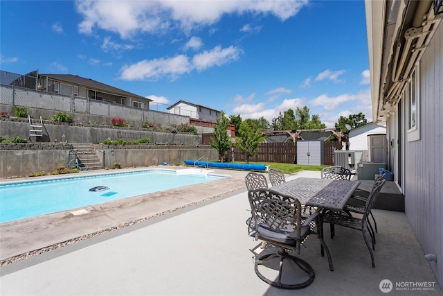 1032 Edgewater Ln, Moses Lake, WA 98837 - view of pool featuring outdoor dining space, a patio, and a fenced backyard