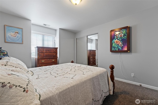 1032 Edgewater Ln, Moses Lake, WA 98837 - carpeted bedroom with multiple windows, baseboards, and a closet