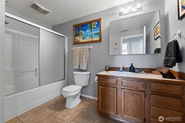 1032 Edgewater Ln, Moses Lake, WA 98837 - bathroom with toilet, tile patterned flooring, vanity, shower / bath combination with glass door, and baseboards