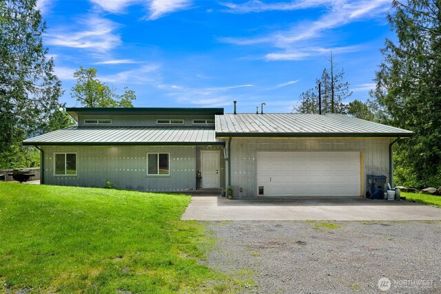 5380 Marshall Hill Rd, Deming, WA 98244 - mid-century modern home featuring a garage, driveway, a front yard, and metal roof