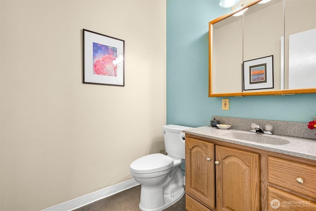5380 Marshall Hill Rd, Deming, WA 98244 - bathroom with toilet, vanity, and baseboards