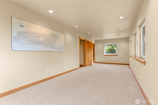 703 S Sand Dune Ave SW, Ocean Shores, WA 98569 - spare room featuring recessed lighting, carpet flooring, and baseboards