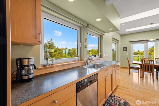 703 S Sand Dune Ave SW, Ocean Shores, WA 98569 - kitchen featuring stainless steel dishwasher, a sink, light wood-type flooring, recessed lighting, and dark countertops
