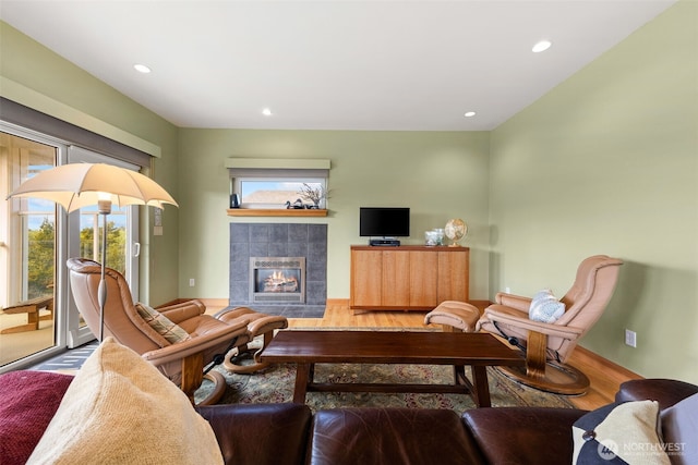 703 S Sand Dune Ave SW, Ocean Shores, WA 98569 - living area with wood finished floors, a fireplace, and recessed lighting