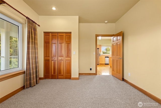 703 S Sand Dune Ave SW, Ocean Shores, WA 98569 - unfurnished bedroom with carpet, baseboards, recessed lighting, and a closet