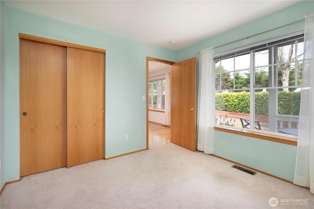 161 W Whidbey Ave Unit 4, Oak Harbor, WA 98277 - unfurnished bedroom featuring carpet and a closet